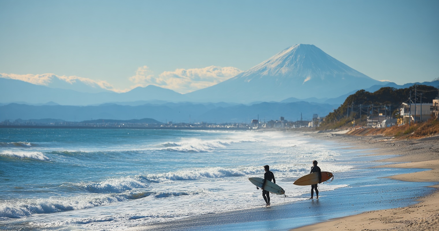 Surfers at Yuigahama Beach with Mount Fuji in distance